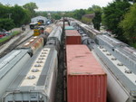 Looking west from the Dodge St. overpass at Iowa City yard.  From right: Grain loads for Cedar Rapids are on the north siding, the inbound RI turn is on the main, the outbound west train's stacks on the siding, the west train's setout of Iowa City/Cedar Rapids cars is on 1 track, local cars on 2 track, the Local crew's engine (701) sits on 3 track, inbound coal empties power on 4, and business car 100, the Hawkeye, is on 5 or the enginehouse track.  Sept. 6, 2007.