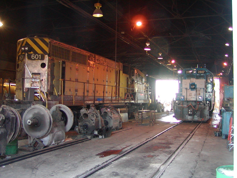 IAIS GP38 601 being prepped for repainting while LLPX SD38-2 2807 is serviced, 10/26/2005.