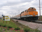 A sign points Hawkeye Express riders to the train at 25th Ave in Coralville, IA before a game on 10/16/04.