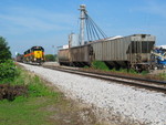 Eastbound is passing fertilizer hoppers at Atalissa, July 2006.