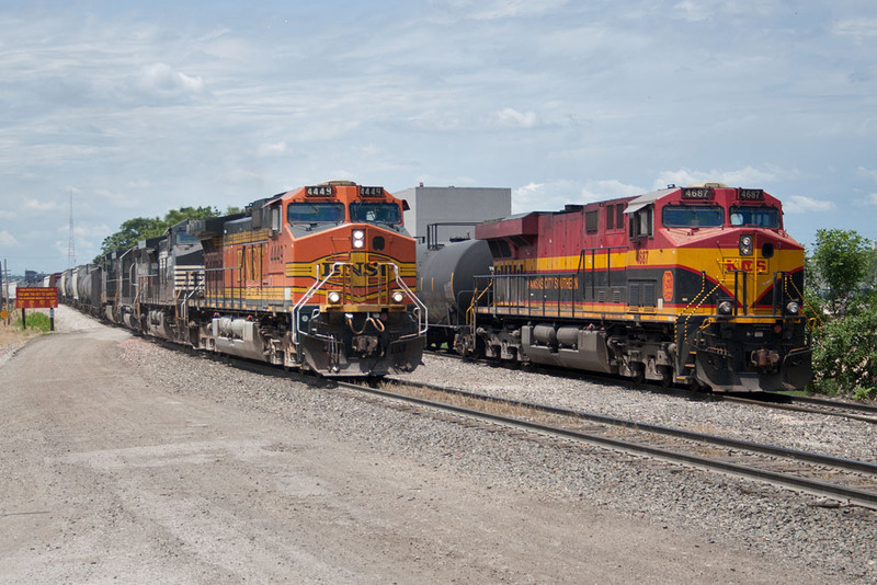 Detouring BNSF 4449 passes the KCS 4687 at 44th St; Rock Island, IL.