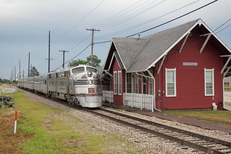 The Nebraska Zephyr heads west by the depot at Geneseo, IL
