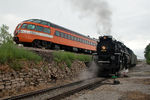 NKP 765 takes headroom on the Milan Branch while the Amtrak special for Muscatine makes a reverse move over the Crescent Bridge.  Rock Island, IL.