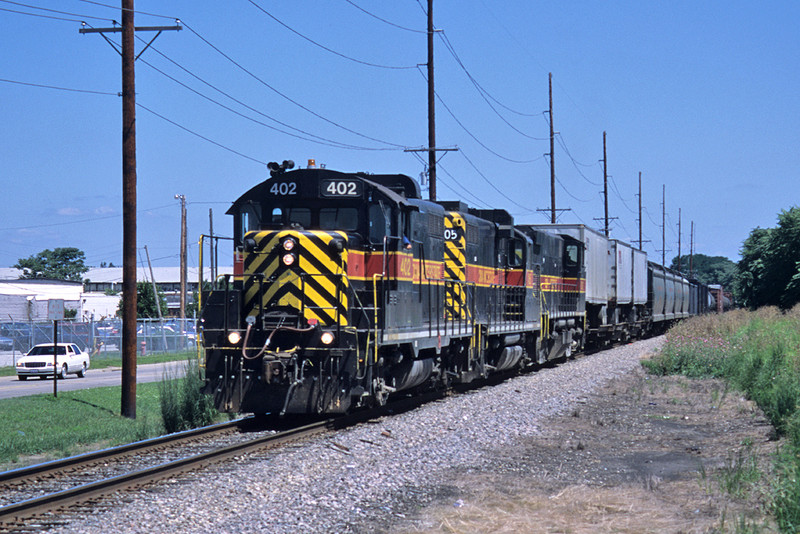 The West train at East Moline, Illinois behind #402 - August 7th, 2002.