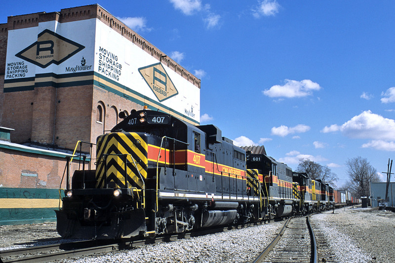 The 407 heads up the "West Train" at the junction in Davenport, Iowa on April Fool's Day 2004. Twenty Four years after the Rock lowered the flag.