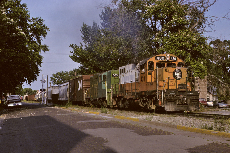 IAIS 430 pals up with the "Green Bean" on a westbound manifest at Davenport, Iowa June 10th, 1992.