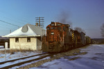 Train #011 passes the depot at DePue, Illinois with #469 up front. February 28th, 1993.