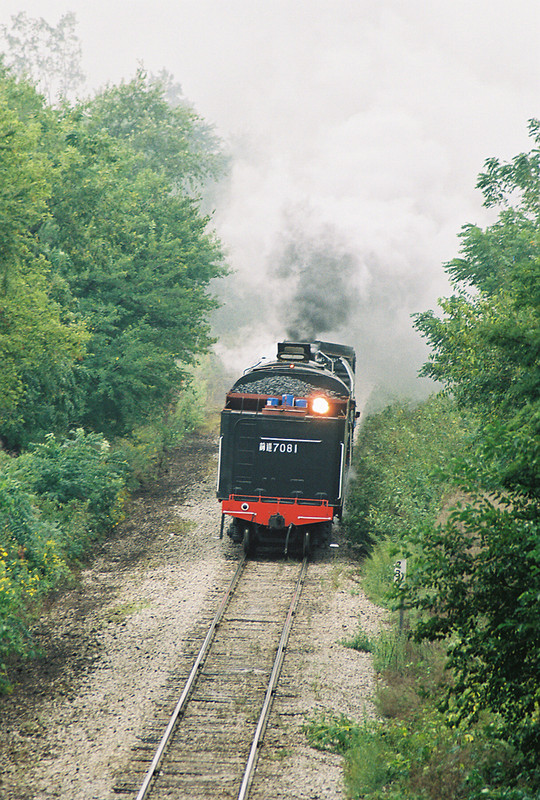 QJ 7081 at Midway Hill running tender first being ferried to the Quad Cities in September of 2006.