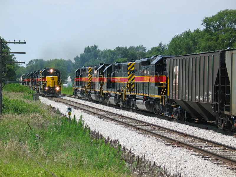 Westboun RI turn (consisting of empty ethanol unit train, with 2 buffer cars on the head end) is cleared up for the eastbound at N. Star siding, mp 211.  July 25, 2006.