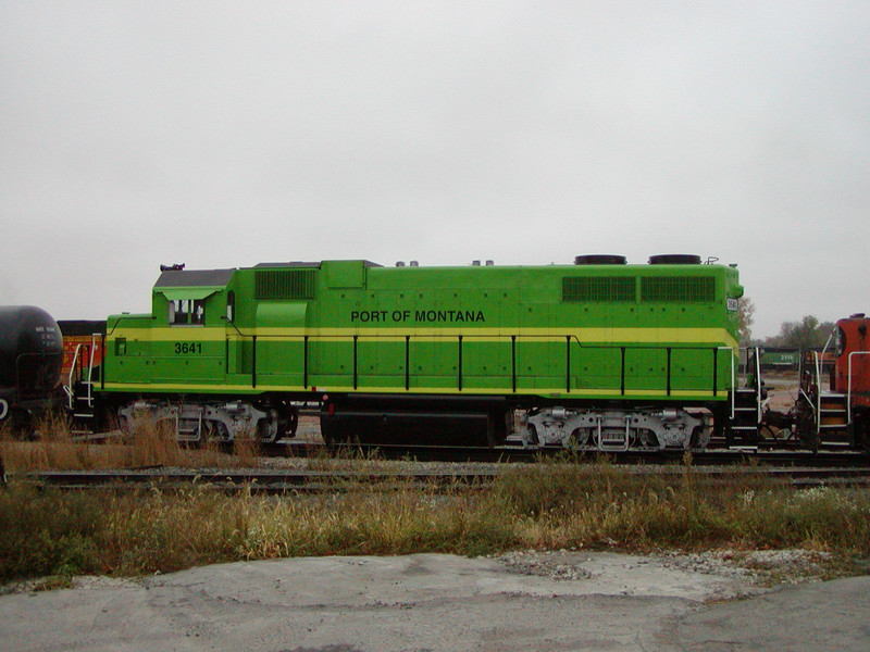 NREX 3641, headed for the Port of Montana at Silver Bow, MT, passes through Council Bluffs on 2-Nov-2003