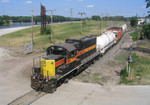 IAIS 403 heads for the Milan Branch as it crosses 24th Street Rock Island, IL on 6/22/04.