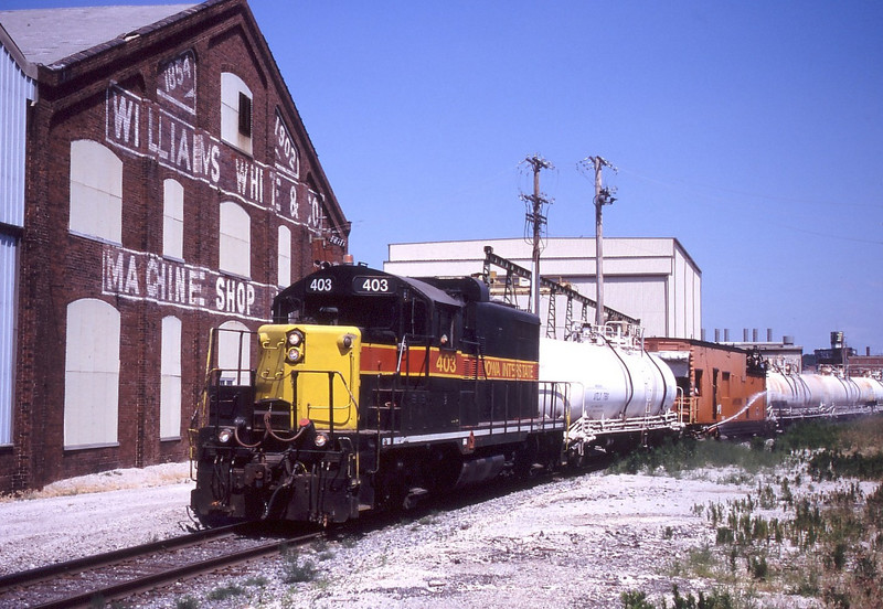 IAIS 403 is seen again passing Williams White Inc in Moline, IL on June 22, 2005.