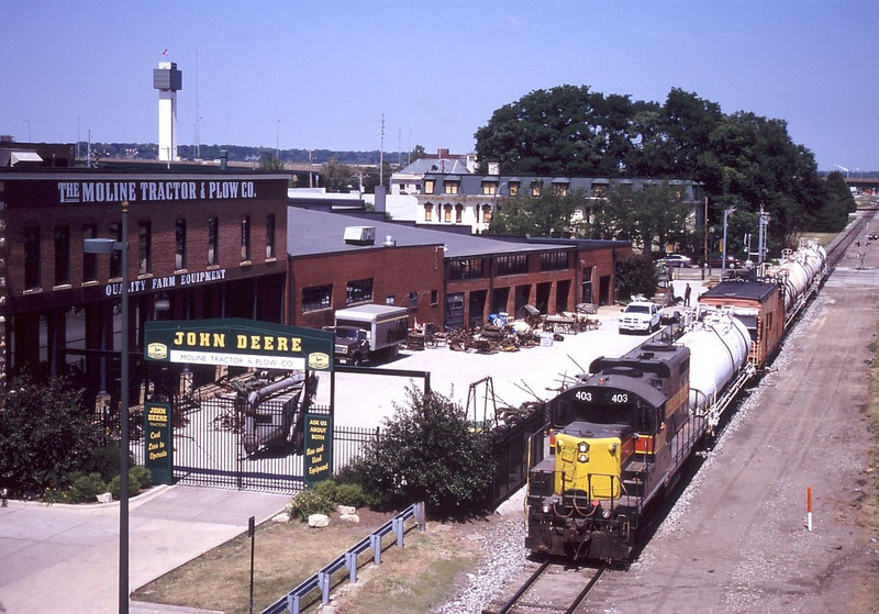 IAIS 403 heads down the "BN Industrial" in Moline, IL with the Asplundh weed sprayer on June 22, 2005.