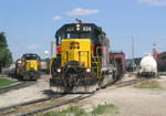 IAIS 403 and the Weed Spray train wait for IAIS 628 to switch out the west end of RI yard on 6/22/05.