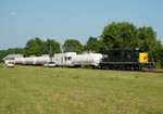 Weed sprayer tied down at Bureau, IL waiting to continue west.  16-Jun-2006.