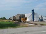 Hancock elevator's trackmobile is fetching more hoppers to load, looking south from Hancock, June 21, 2006.
