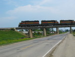 West train on the Hancock overpass, June 21, 2006.  In the background are hoppers parked on the connection track for Hancock elevator.
