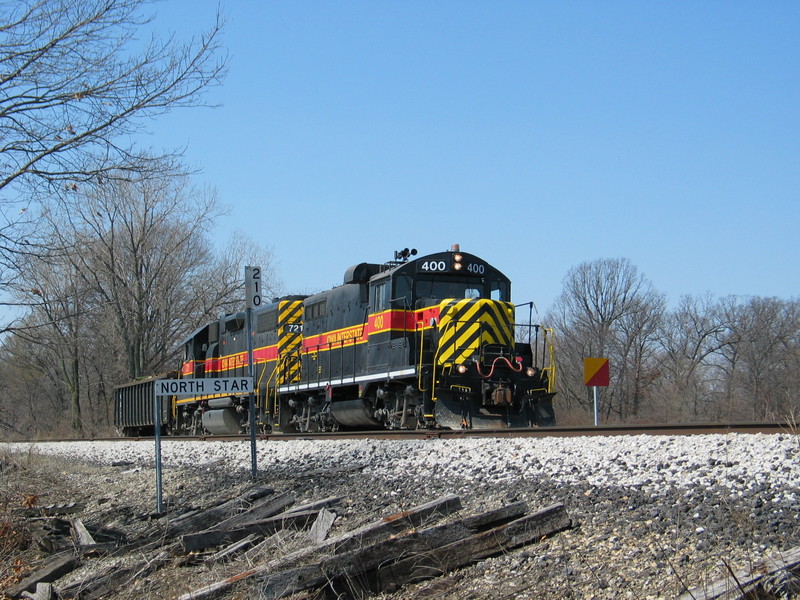 Wilton Local at mp 210, passing the track gang's caution board.  April 10, 2006.