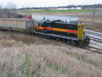 400 pulls back down to the siding, Nov. 14, 2005.  In the background are 2 empties from JM, and several loads of scrap for Gerdau.  Coupled to 400 is a fertilizer load for Atalissa.