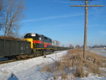 Wilton Local at the N. Star crossover, mp 208.5.  On the pocket are several 52' empty gons for Gerdau loading.