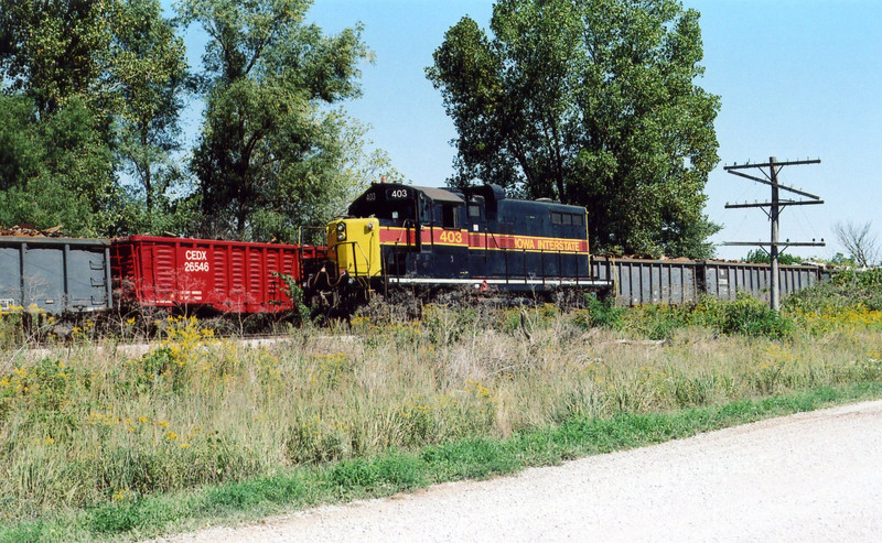 Eng. 403 backs east past cars on the Wilton Pocket, mp 208.3, Sept. 14, 2005.