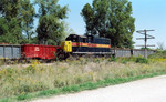 Eng. 403 backs east past cars on the Wilton Pocket, mp 208.3, Sept. 14, 2005.