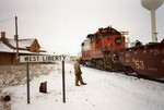 Eng. 481 switches stack cars at West Lib., as the Iowa City carman checks 'em out.  March 23, 2005