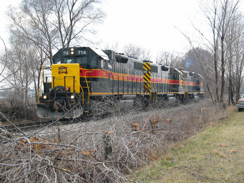 The RI crew is backing the 3 700s down onto their train, past the mayhem left by the brush cutter.  Moscow, mp211, March 30, 2006