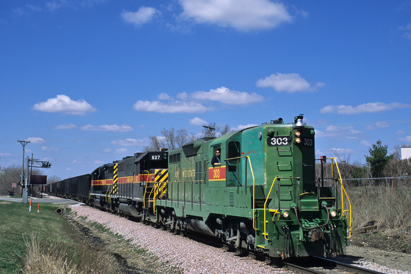 #303 brings the East train in at Davenport, Iowa April 1st, 2004.