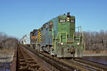 303 comes across the Cedar River at Moscow, Iowa with an eastbound on November 24th, 1999.