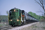 #303 leads a westbound cut of syrup cars at Moscow, Iowa March, 26th, 2004.
