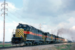 103 ducks in to the clouds with a westbound manifest at Davenport, Iowa April 22, 1998
