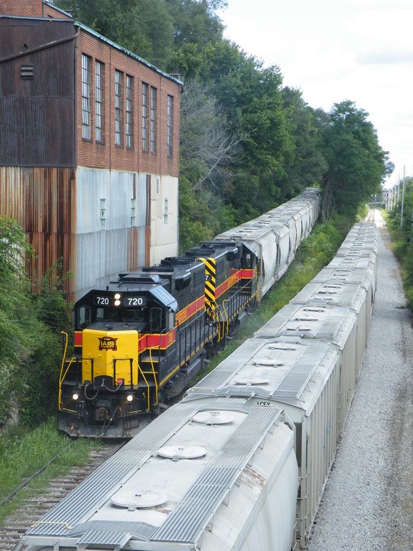 Shoving up the grade with a cut of 18 cement loads, the two GP38-2's are on their hands and knee's... of course I got clouded for the shot, but luckily there is another cut of 18 loads waiting on the main for them to shove up!