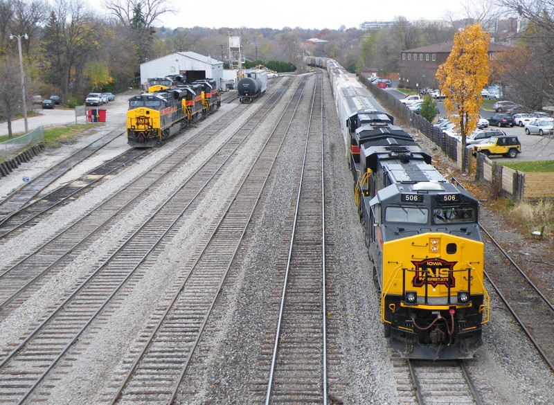 506 and 507 lead the east train down the main in Iowa City. They will make a small pick-up, and grab two GP38-2's before meeting the west train east of the yard.