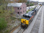 The class unit of the GE's idles away at the yard office while CBBI makes a pick-up.