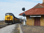 CBBI cruises into town in full dyno's preparing to stop and drop the 50+ loaded grain cars in the siding.