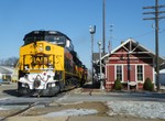 Big power passes the Chillicothe depot on the usually GP38-2 powered local to Peoria.