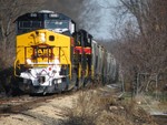 BUSW bounces down Sub 2 through the small town of Coughlin, IL. It was pretty entertaining watching these big GE's and their fancy modern flex-coil trucks slam this jointed rail into submission.