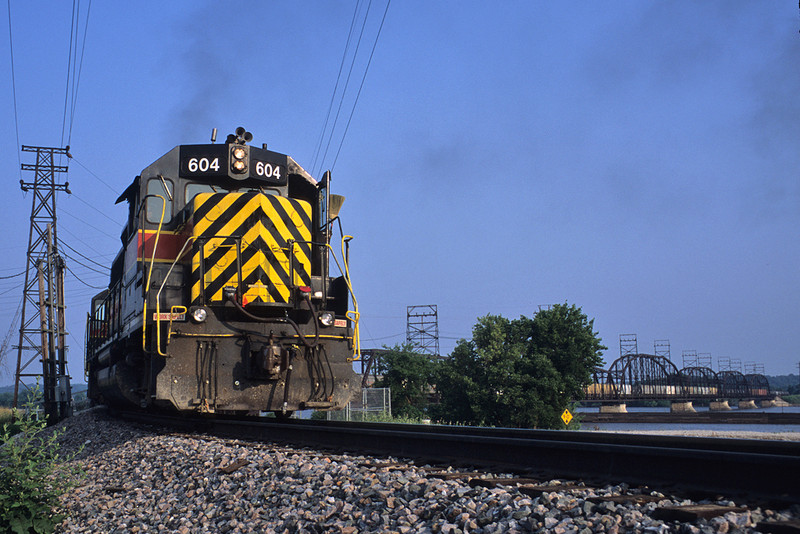 A detour train comes off the Crescent Bridge at Rock Island, Illinois with #604 up front.