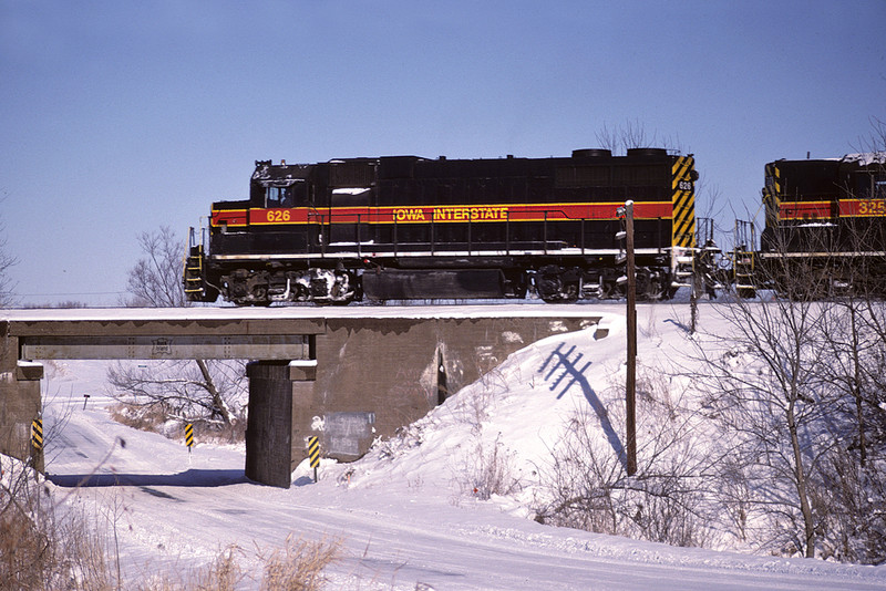 The West train led by #626 over Wisconsin Avenue, Davenport, Iowa January 20th, 2000.