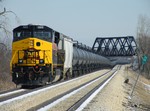 Iowa 502 brings up the rear of ANBIU as the train slithers under the former Wabash.