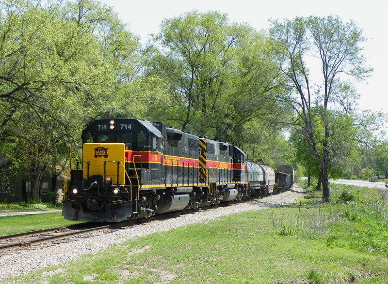 Rolling through Mossville, the two GP38-2's have a good roll on em' swinging through a sweeping curve.