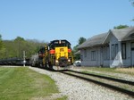 While working the little yard east of the junction, Iowa 714 takes headroom past the vintage depot still standing between Sub 1 and Sub 2.