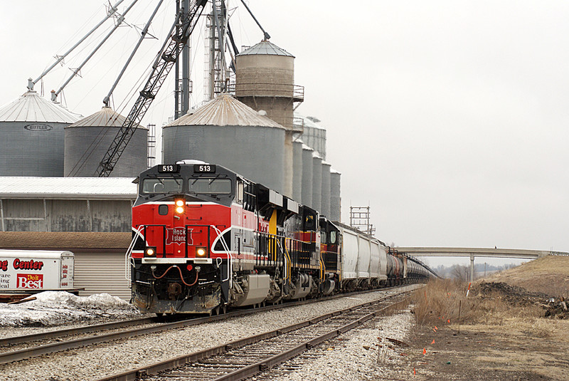 A fellow railfan watches and takes pictures from the bridge.