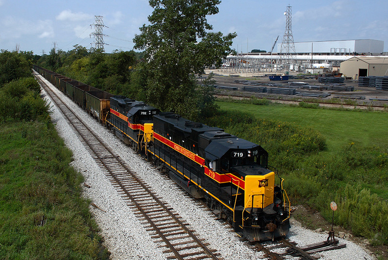 A CRPE empty coal bucket crawls through the North Star siding led by 719 at Wilton, Iowa August 21st, 2007.