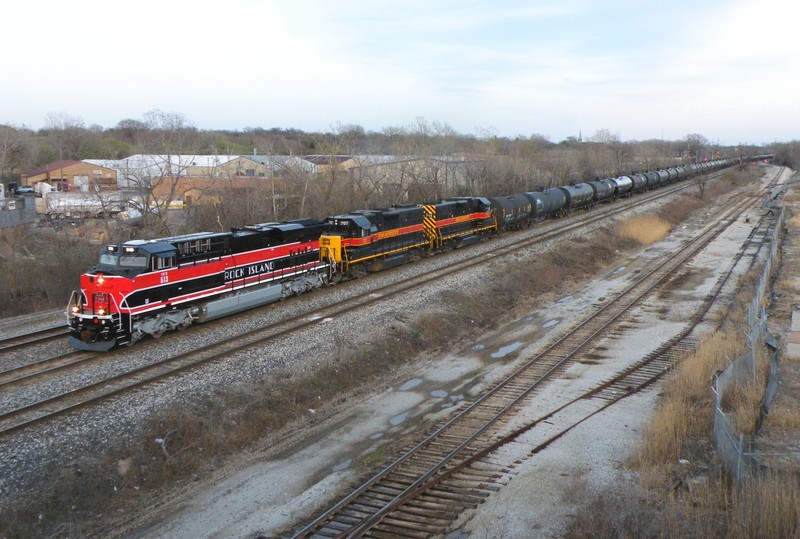 As the sun sets into the thick haze, the three units throttle up down Harbor's main about to pass under Kedzie Ave, 04-03-10