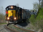 Strolling towards Joliet, ANBIU symboled as CSXT Z032 13 eeks around a bend on the east side of Rockdale parallel to Rte 6. 04-13-10