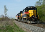 Strolling towards Joliet, ANBIU symboled as CSXT Z032 13 eeks around a bend on the east side of Rockdale parallel to Rte 6. 04-13-10