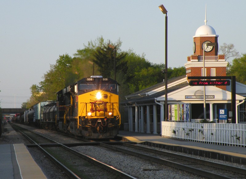 Sister units 508 and 509 double team a short 60 car BICB through the dicey shadows at Midlothian. 04-16-10