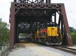 Emerging from CSXT's Bridge 407, the extra drops their Z026 CSX symbol and resumes using their ANBIU symbol as they enter Metra territory. 05-18-10